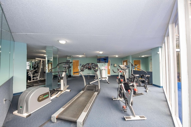 exercise room with a textured ceiling