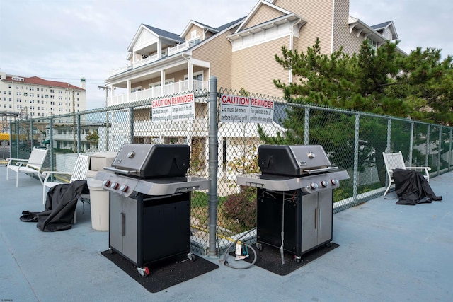 view of patio / terrace featuring area for grilling and a balcony