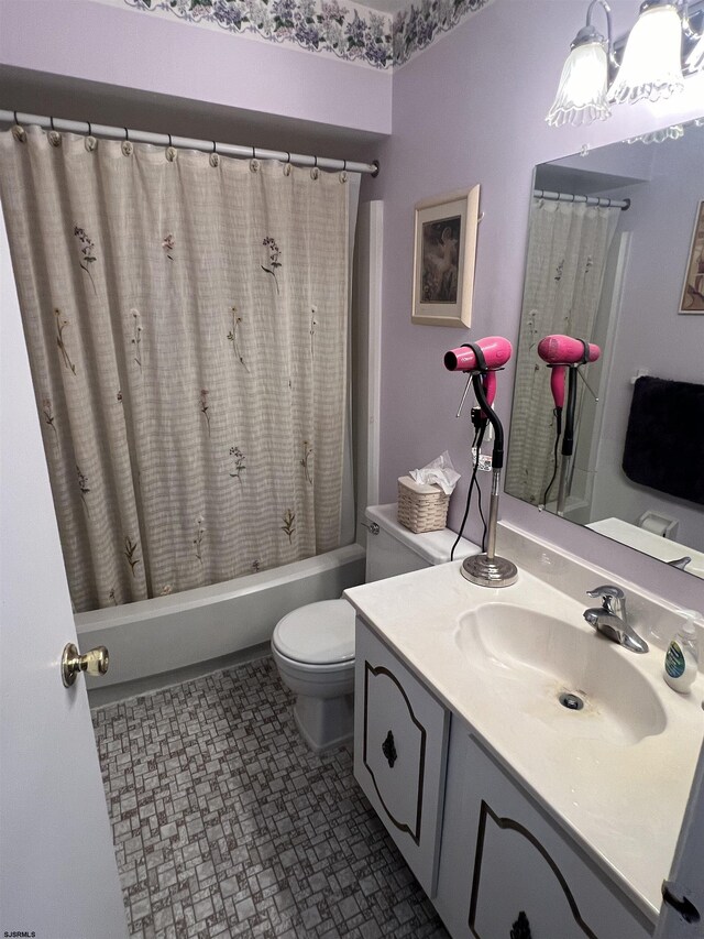 full bathroom featuring vanity, toilet, and shower / bath combo with shower curtain