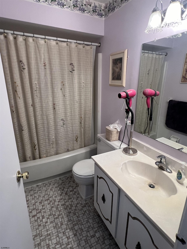 full bath featuring vanity, toilet, and shower / bath combo