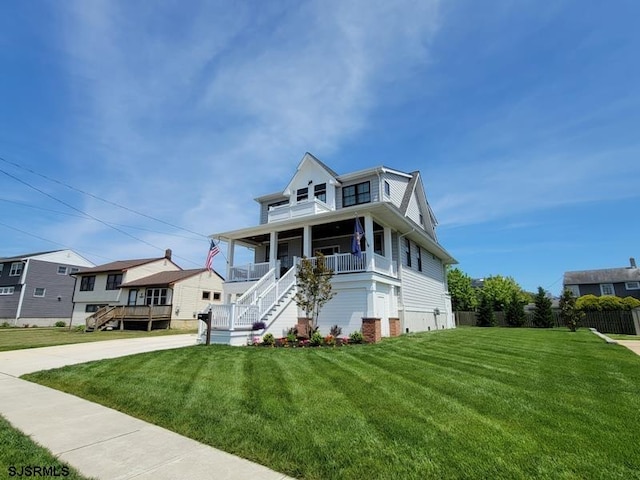 view of front facade with covered porch and a front yard