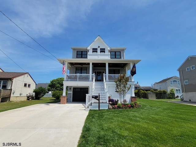 beach home featuring covered porch and a front yard