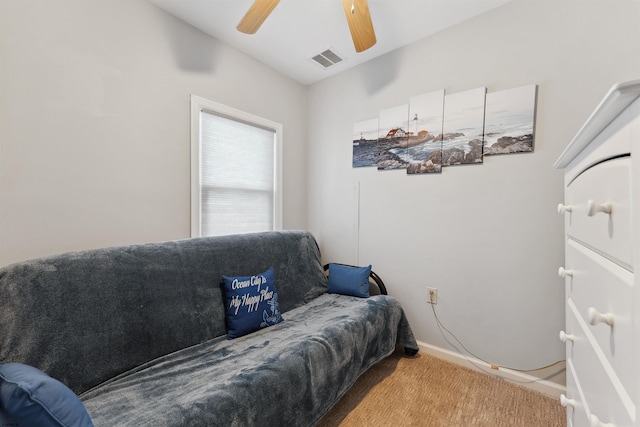 interior space featuring ceiling fan and carpet flooring