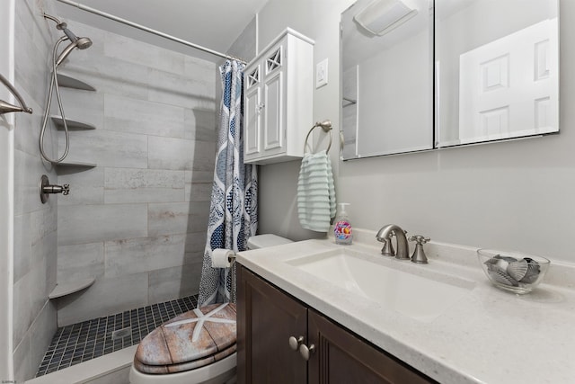 bathroom featuring vanity, toilet, and a shower with shower curtain