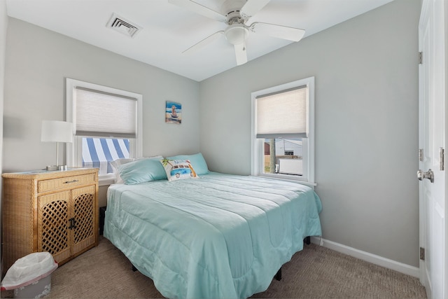 bedroom featuring dark carpet and ceiling fan