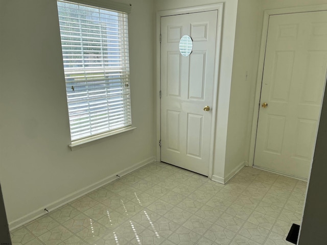 entrance foyer featuring light tile patterned floors