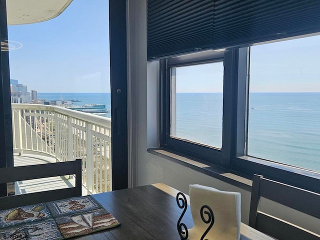 interior space with a view of the beach and a water view