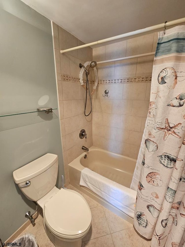 bathroom featuring tile patterned flooring, toilet, and shower / bath combination with curtain