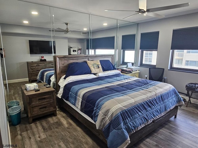 bedroom featuring ceiling fan and dark hardwood / wood-style flooring