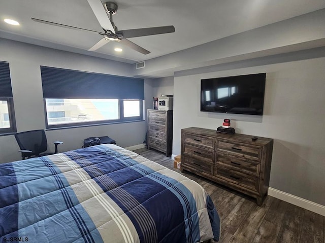 bedroom featuring dark wood-type flooring and ceiling fan