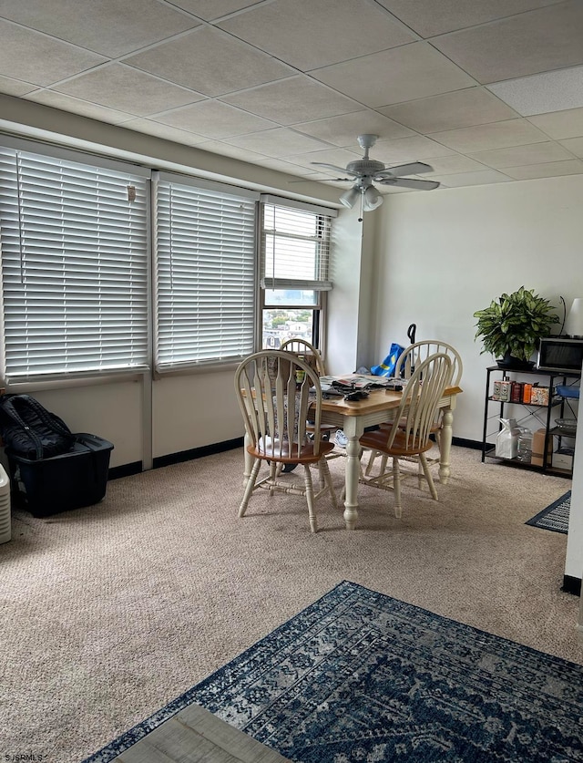 dining room with ceiling fan and carpet floors