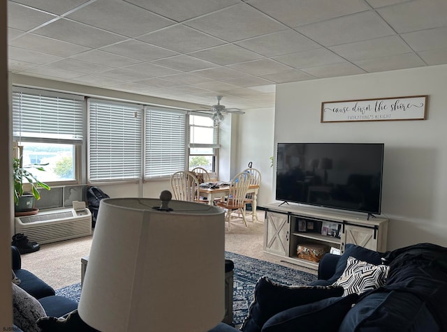 living room featuring carpet flooring and ceiling fan