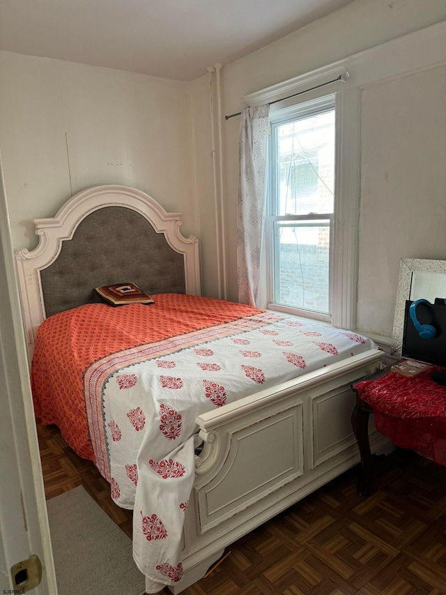 bedroom featuring dark parquet floors