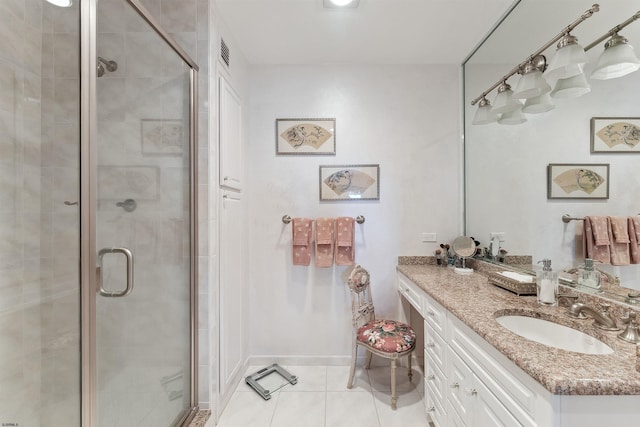 bathroom featuring vanity, walk in shower, and tile patterned floors