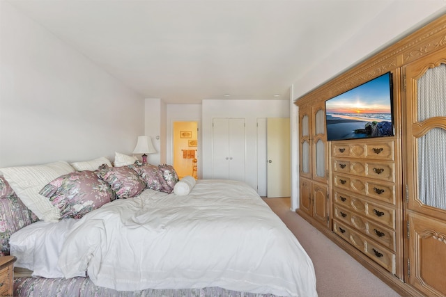 bedroom with light colored carpet