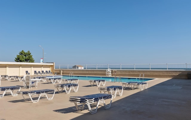 view of swimming pool featuring a patio