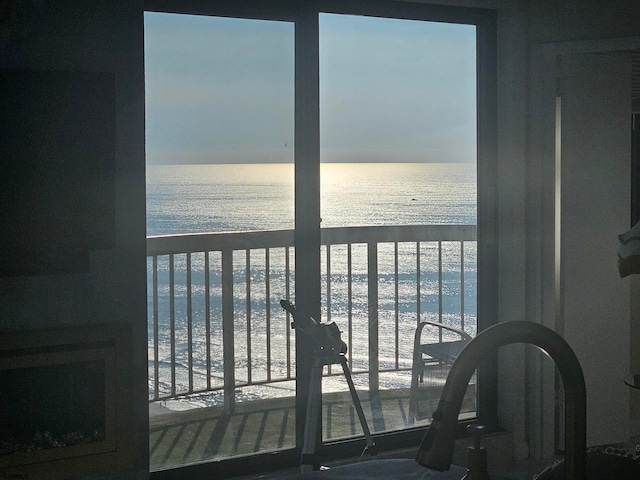 balcony with a view of the beach and a water view