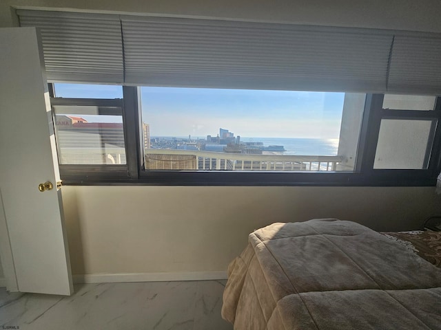 bedroom featuring a water view