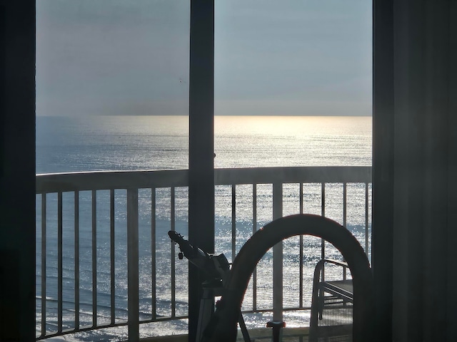 balcony featuring a water view