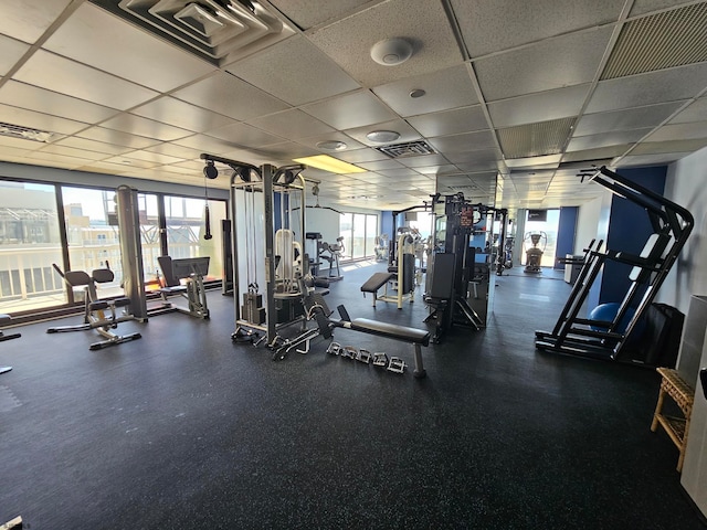 workout area with a drop ceiling