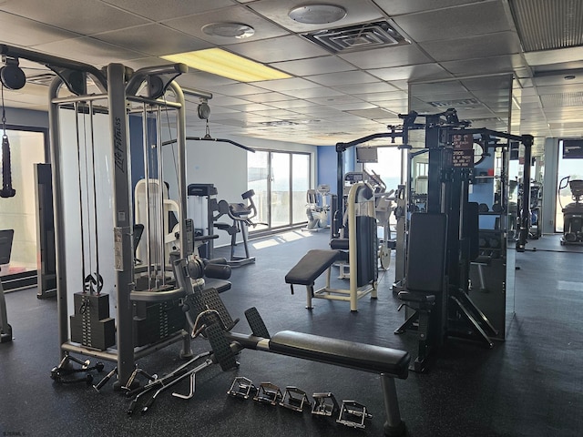 exercise room with a drop ceiling