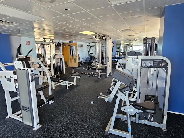 workout area featuring a drop ceiling