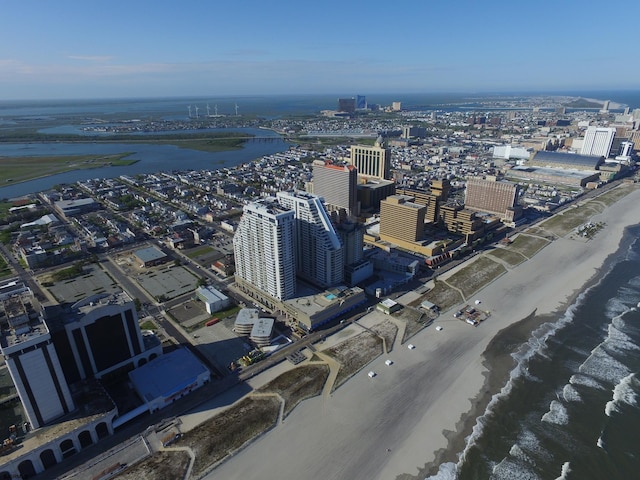 bird's eye view with a view of the beach and a water view