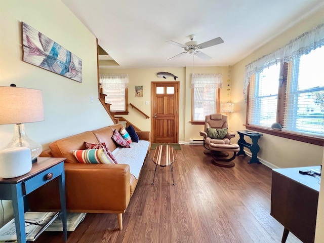 living room featuring hardwood / wood-style floors and ceiling fan