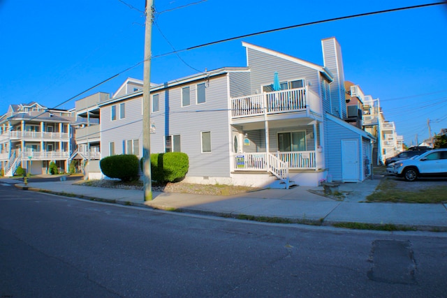 view of front of home with a balcony and a porch