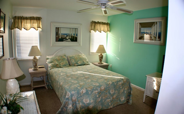 bedroom with dark colored carpet and ceiling fan