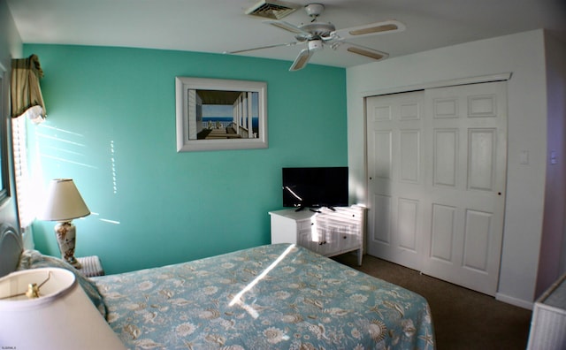 carpeted bedroom with a closet and ceiling fan