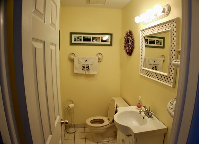 bathroom featuring vanity, toilet, and tile patterned floors