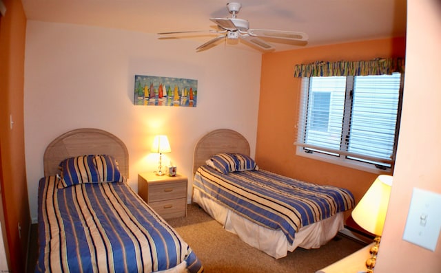 bedroom with ceiling fan and carpet floors