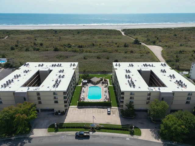 bird's eye view featuring a water view and a view of the beach