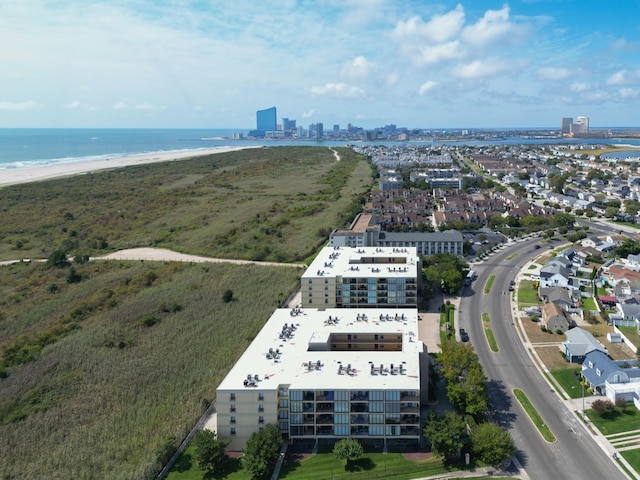 birds eye view of property featuring a water view and a view of the beach