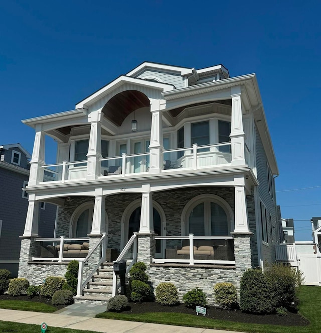 view of front of home with a balcony