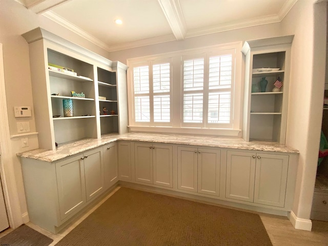 interior space with ornamental molding and light hardwood / wood-style floors