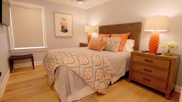 bedroom with light wood-type flooring