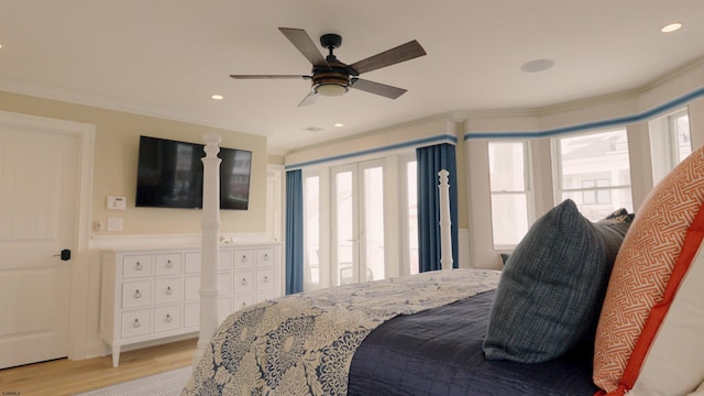 bedroom featuring light wood-type flooring, ceiling fan, and ornamental molding