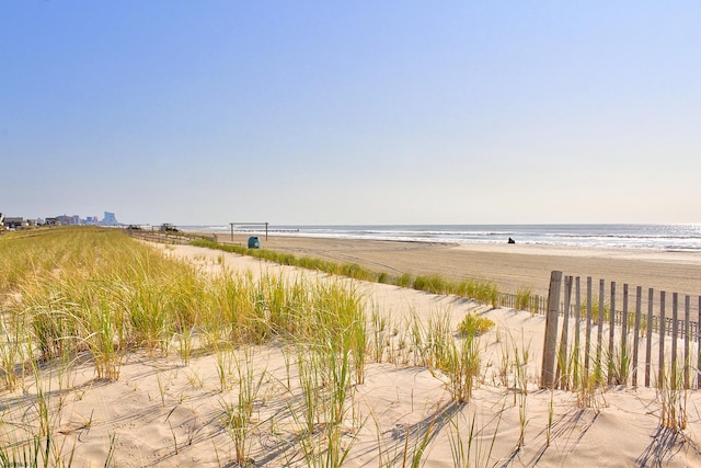 property view of water featuring a beach view