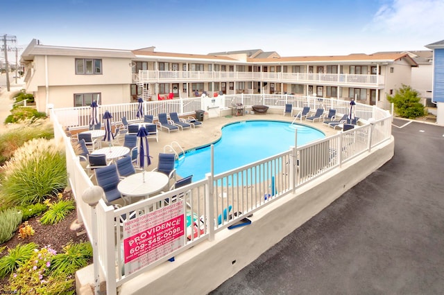 view of swimming pool featuring a patio area