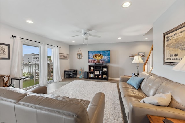 living room featuring light wood-type flooring and ceiling fan