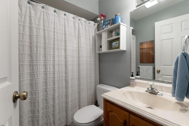 bathroom with vanity, toilet, and a shower with shower curtain