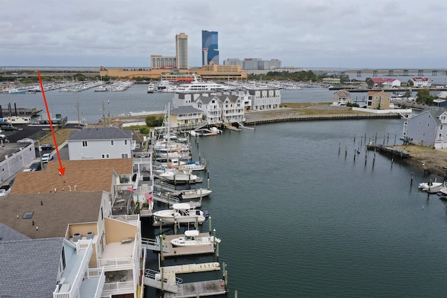 birds eye view of property featuring a water view