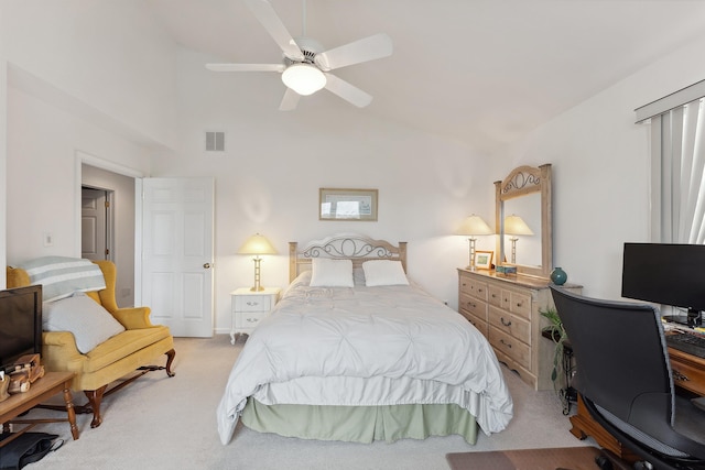 carpeted bedroom with vaulted ceiling and ceiling fan