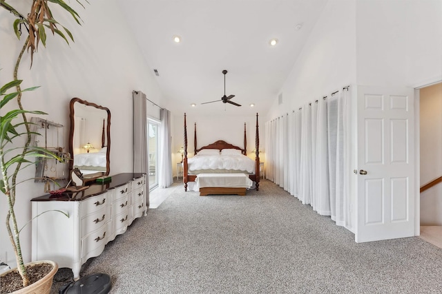 bedroom featuring light carpet and high vaulted ceiling