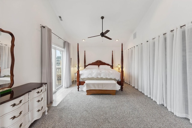 bedroom with light carpet and high vaulted ceiling