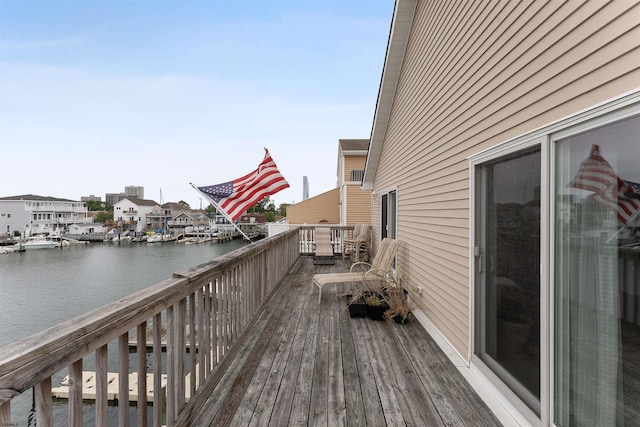 wooden deck with a water view