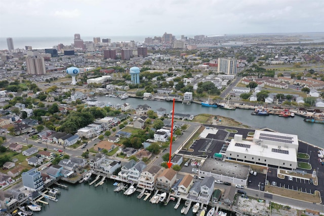 birds eye view of property with a water view