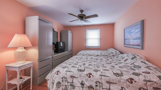 bedroom with wood-type flooring and ceiling fan